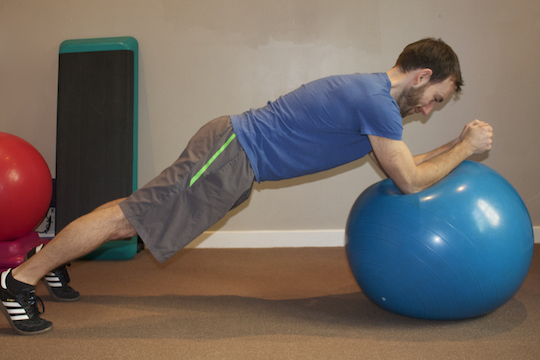 Vancouver Chiropractor and ART Provider Demonstrating Plank and Stir The Pot Core Exercise